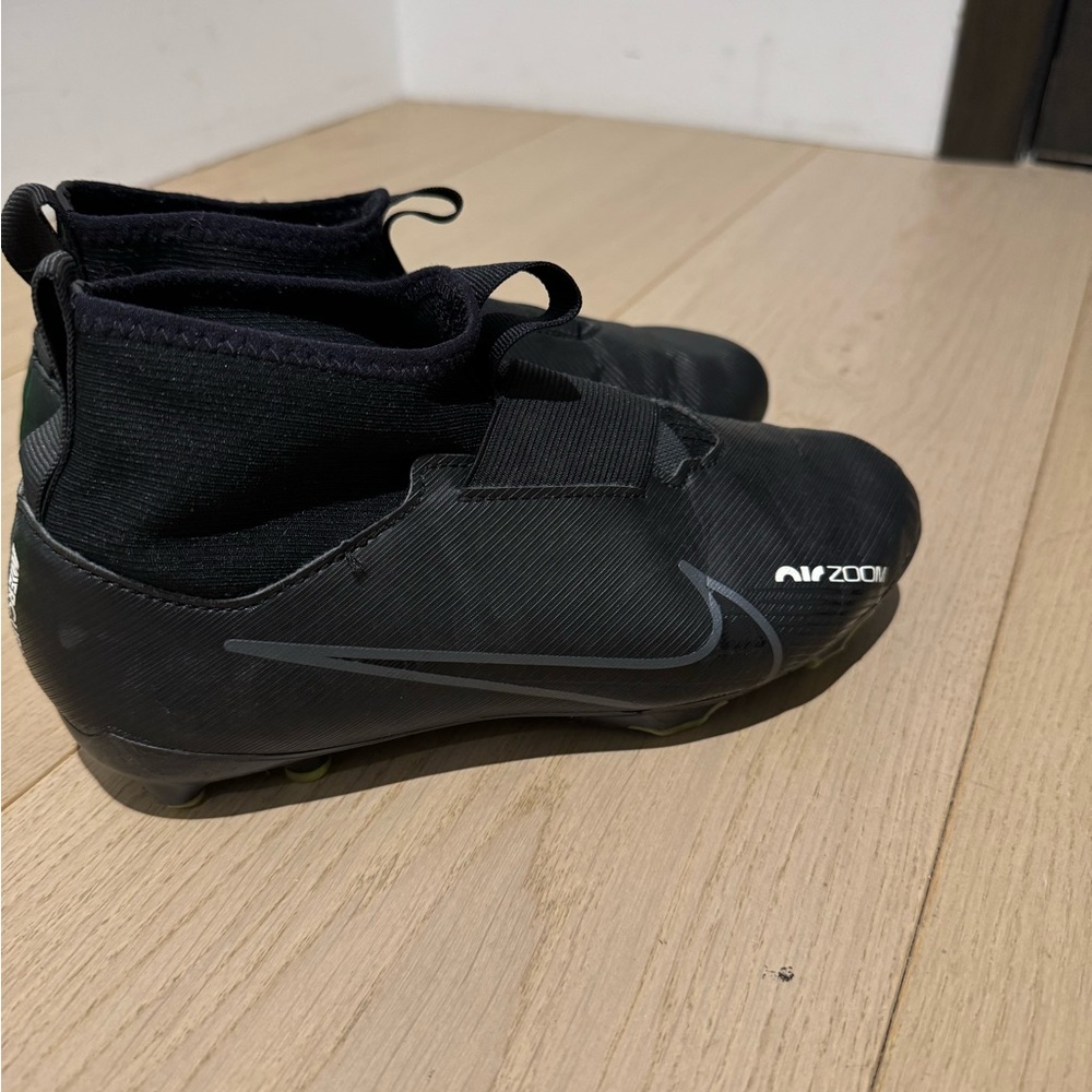 Nike Kids Black Soccer Cleats with Gray Swoosh